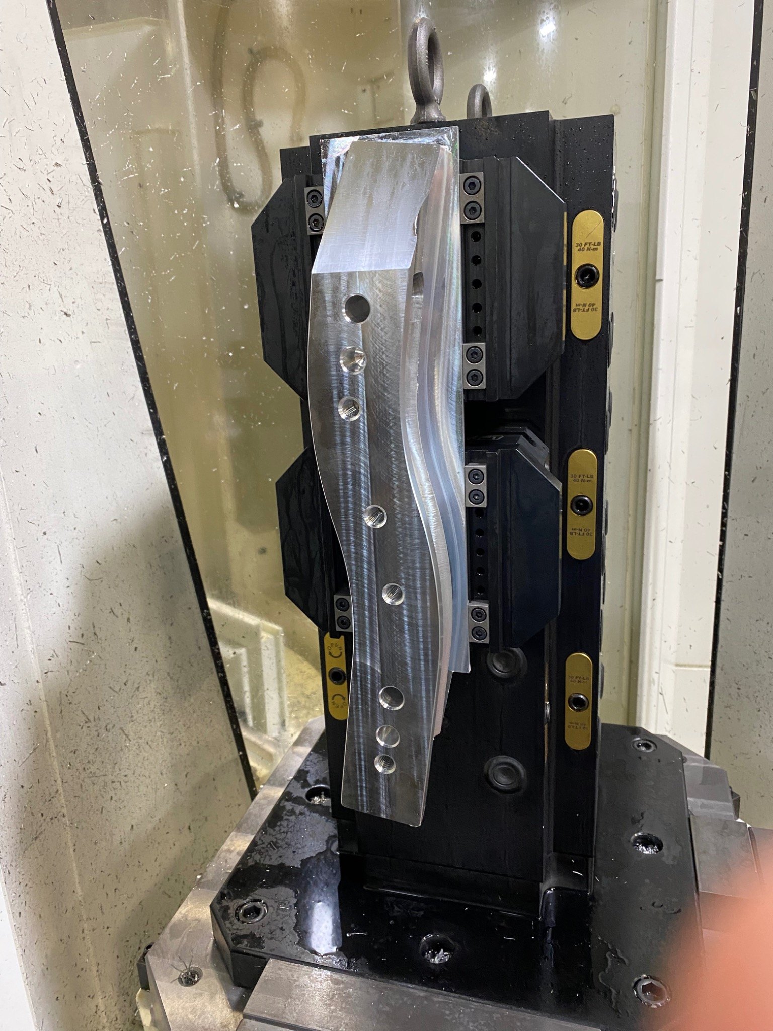Marine production component held in tombstone workholding during 5-axis machining