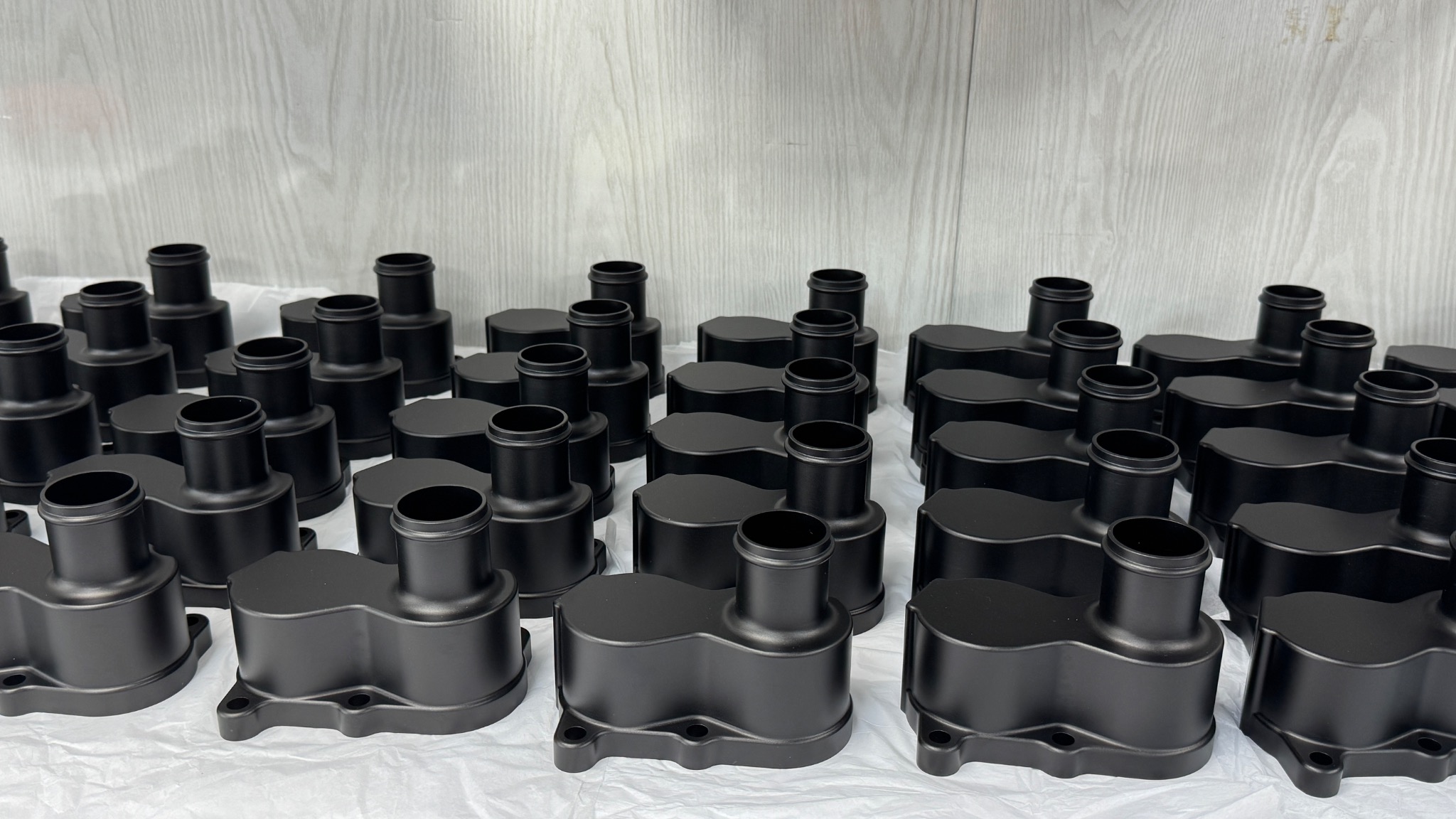 Batch of finished manufactured parts showing repeatable production